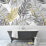 Oversized black gold palm mural above vintage clawfoot tub, line-drawn leaves with gold fronds