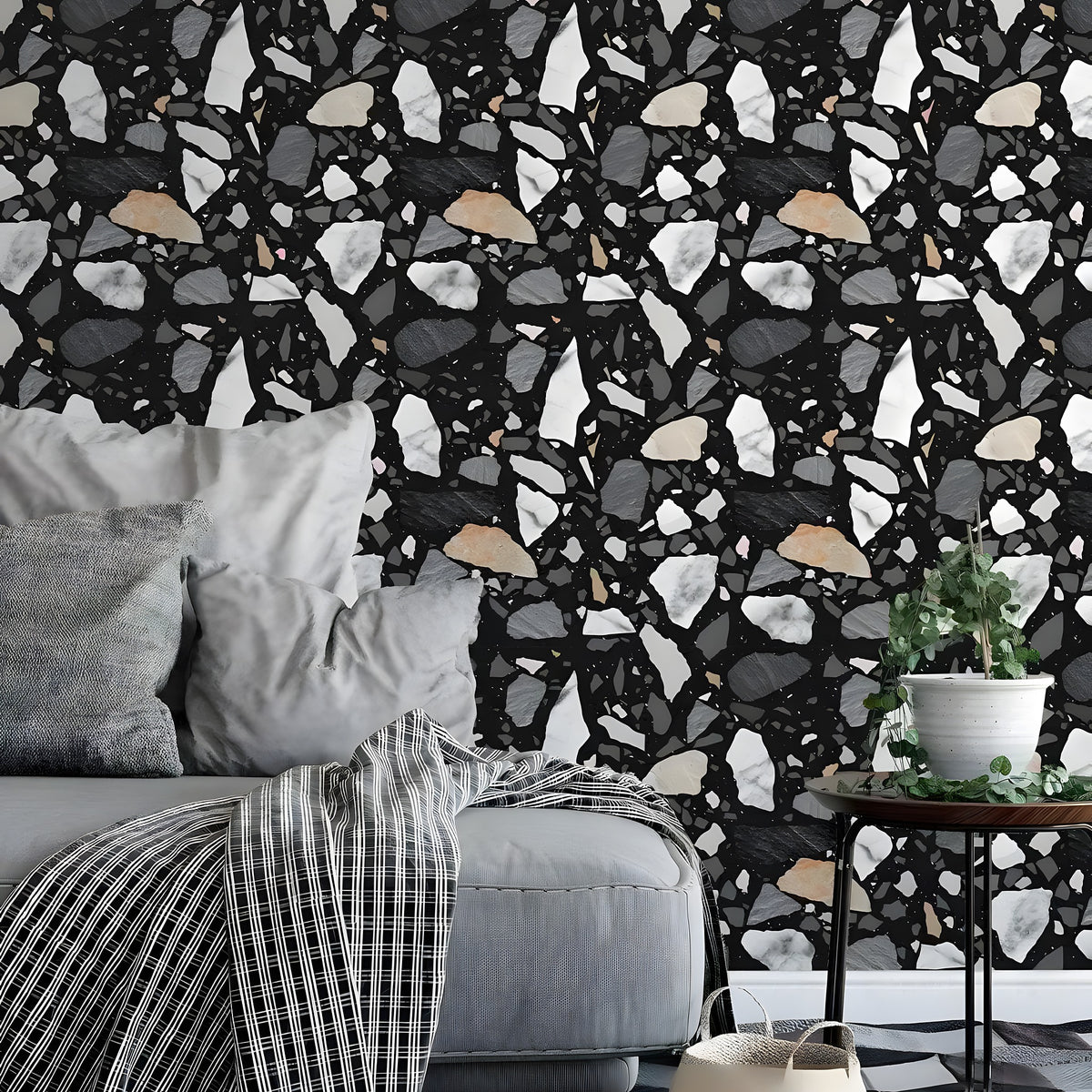 Black terrazzo wallpaper with white gray and tan stone fragments installed in living room