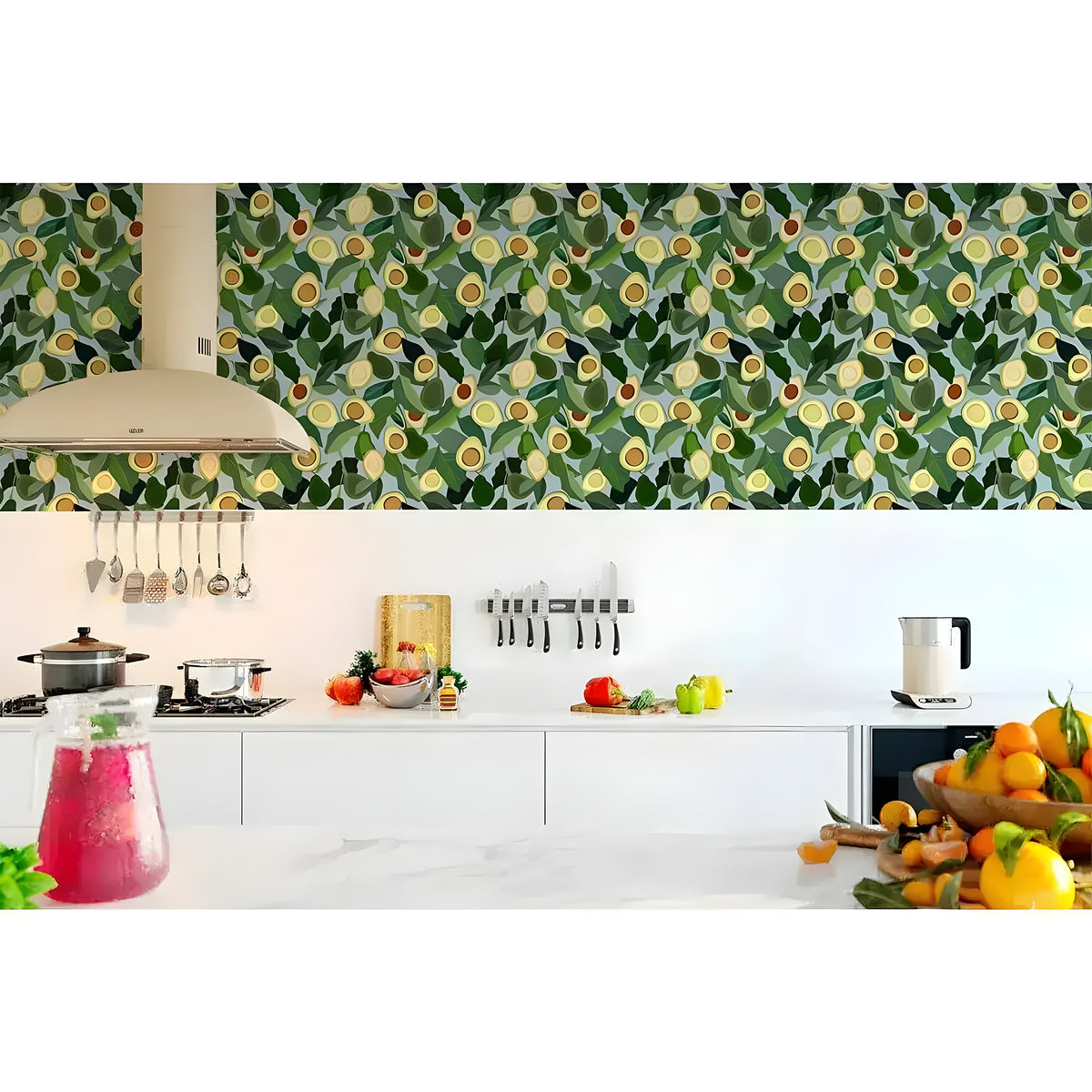 Yellow avocado kitchen wallpaper as backsplash above white cabinets, dark green foliage packed with halved avocados