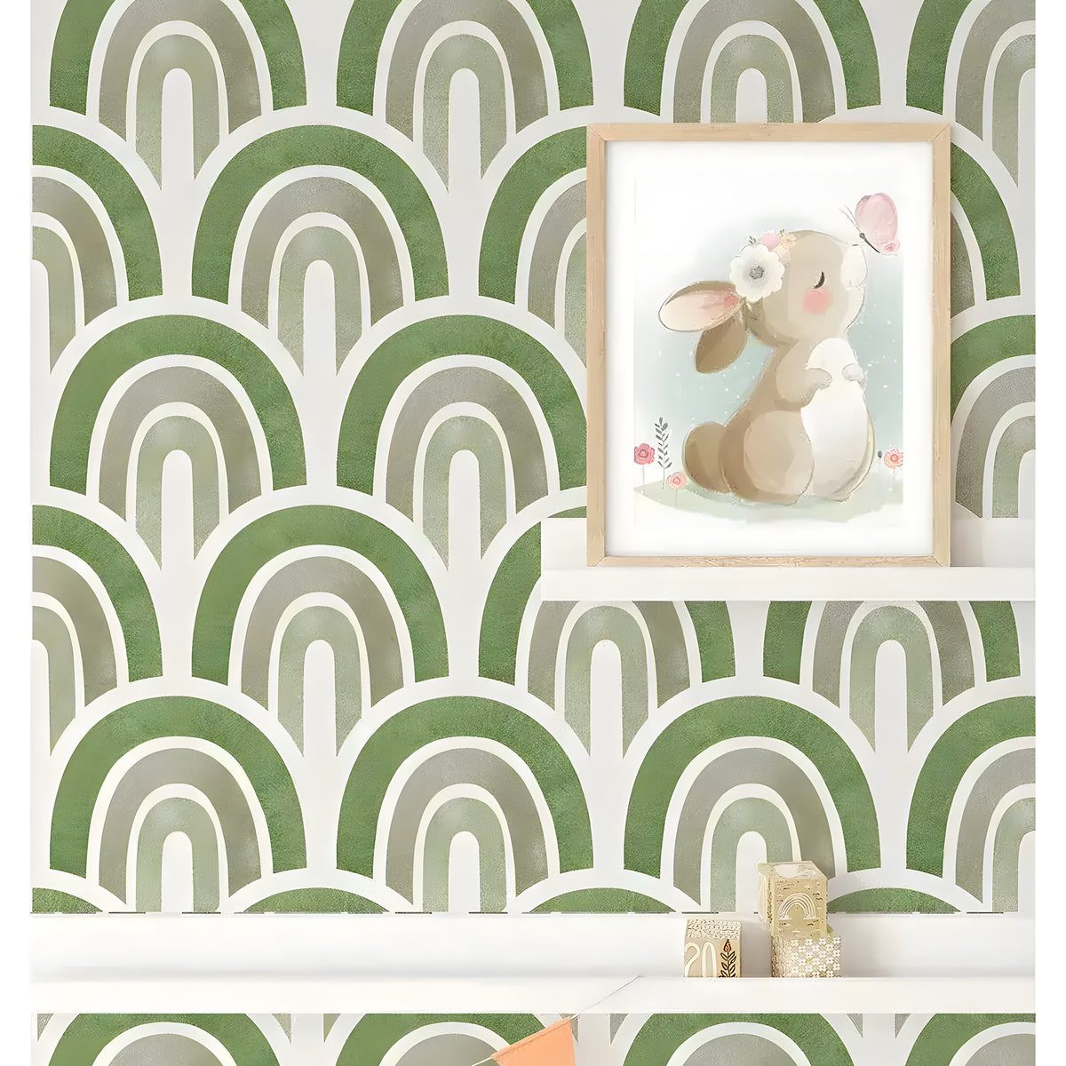 Green waves boho wallpaper in a nursery with bunny art print and colorful bunting banner