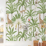 Tropical safari nursery wallpaper in a kids' room, giraffes, elephants, and monkeys among tall green palms