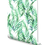 Botanical green leaves removable wallpaper roll showing diagonal palm leaf watercolor pattern
