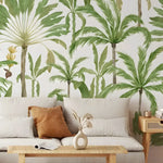 Exotic palms tropical wall mural in a living room with linen sofa and rattan coffee table