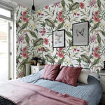 Floral hibiscus roses wallpaper in a bedroom, pink hibiscus and plumeria on white with green tropical leaves
