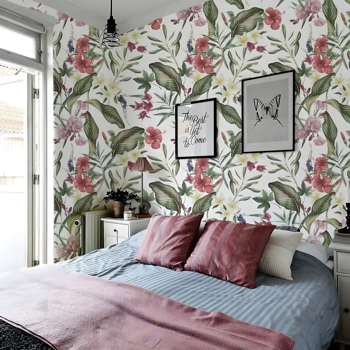 Floral hibiscus roses wallpaper in a bedroom, pink hibiscus and plumeria on white with green tropical leaves