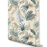Rolled swatch of Green Palm Leaves Tropical Boho wallpaper — mixed monstera and palm fronds in sage and tan on cream