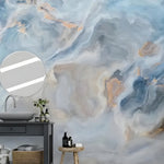 Blue gray abstract marble painting mural in a bathroom with dark vanity and round mirror