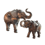 Two solid brass elephant betel storage boxes with raised trunks and engraved decorative detail