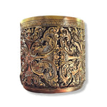 Front view of hand-engraved brass mug body covered in intricate floral scroll artwork
