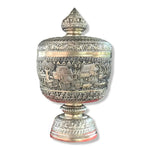 Side view of the mini silver niello bowl on pedestal with lid, engraved with stilt-house village scene