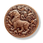 Top-down view of the brass niello betel box lid engraved with a Singha lion amid swirling foliate scrolls