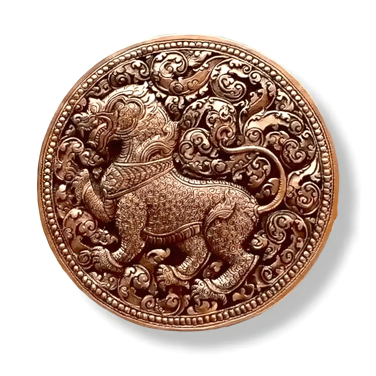 Top-down view of the brass niello betel box lid engraved with a Singha lion amid swirling foliate scrolls