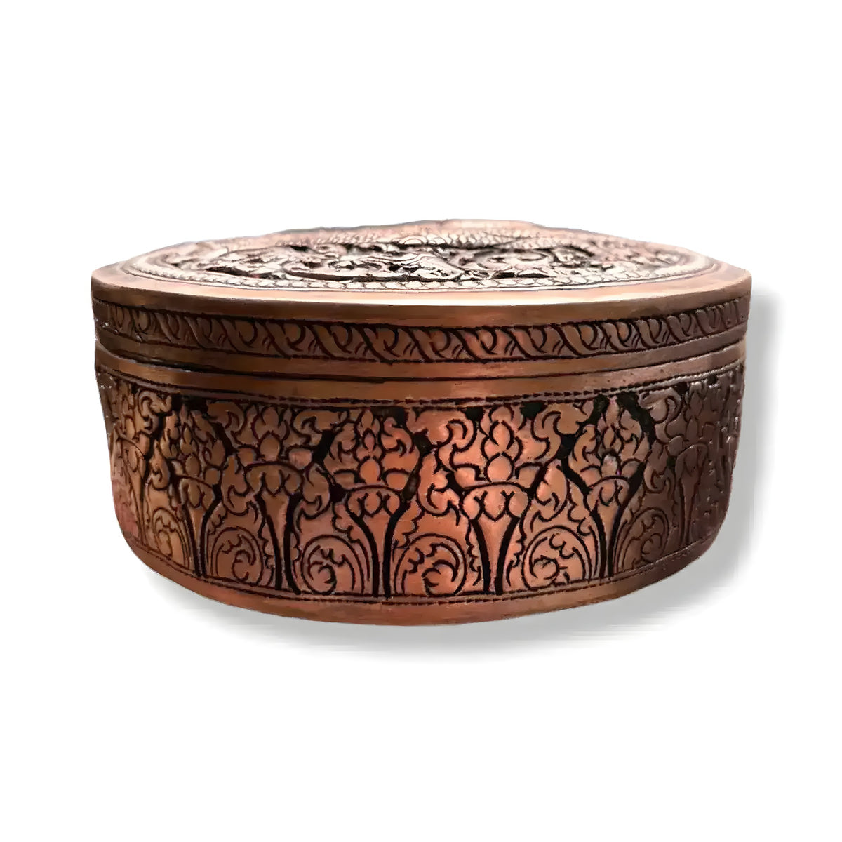 Mini round Naga brass betel box, closed, dense hand-engraved floral scrollwork on sides and lid, warm copper-bronze patina
