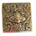Top-down view of square Yaksa brass niello betel box, demon face with fangs on black niello and floral scrollwork