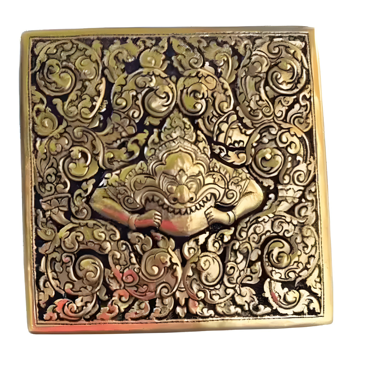 Top-down view of square Yaksa brass niello betel box, demon face with fangs on black niello and floral scrollwork