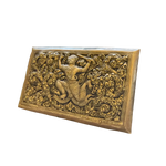 Angled view of rectangular brass niello Hanuman betel box lid, raised warrior figure in golden swirling scrollwork