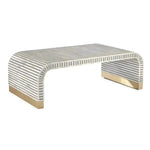 Gray and white vertical stripe bone inlay waterfall coffee table with polished brass feet, angled 3/4 view