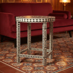 Desi Black and White Bone Inlay End Table styled in a room setting