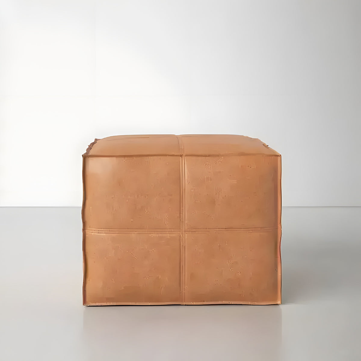 Light brown square leather pouf ottoman, front view, four-panel seamed surface, white background