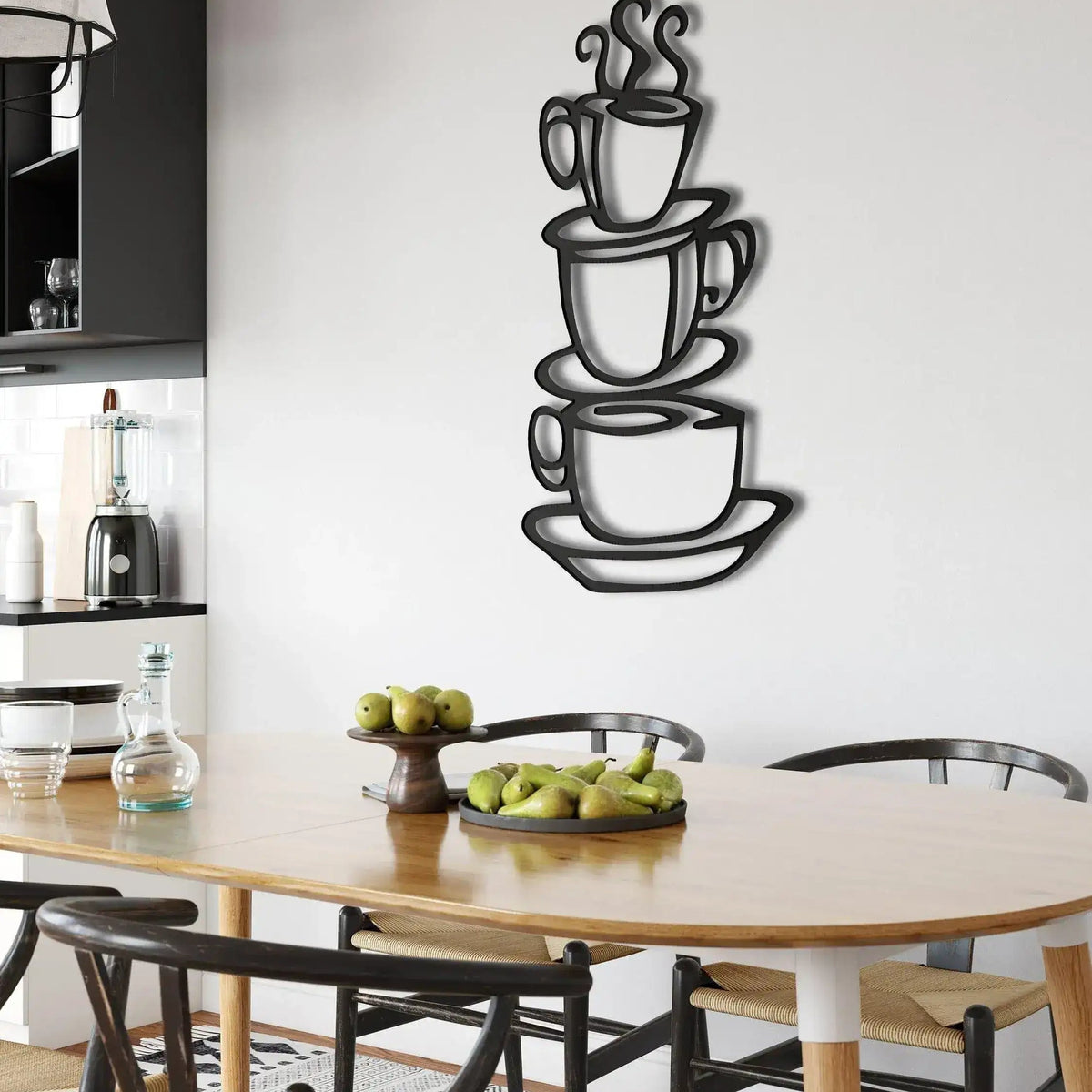 Three black stacked coffee cups with steam outline on white wall in modern kitchen dining area