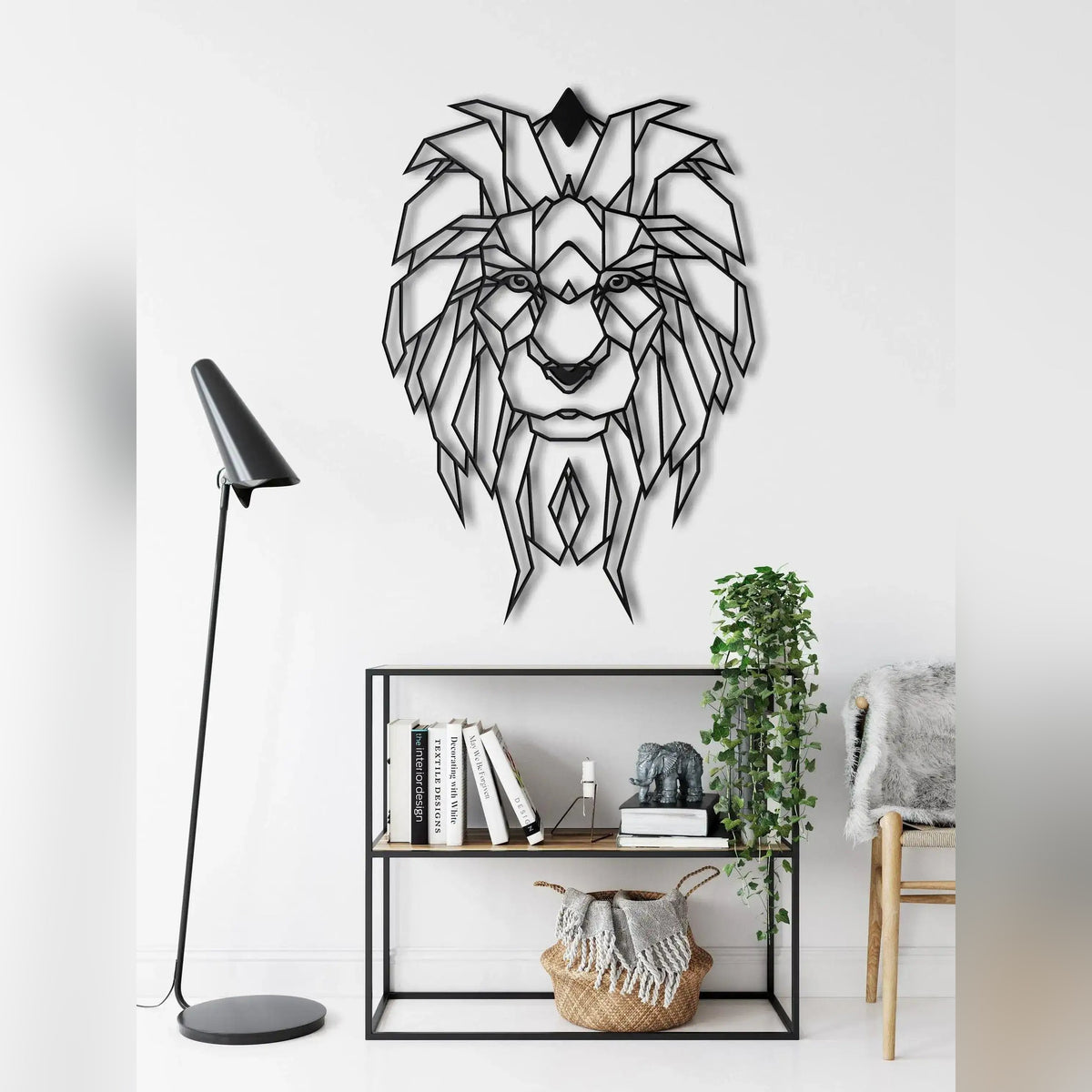 Black geometric lion head metal wall art in living room with shelving and floor lamp
