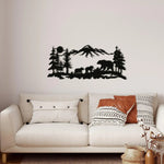 Black family bear metal wall art, silhouette of bears in pine forest with mountains, displayed in living room above sofa