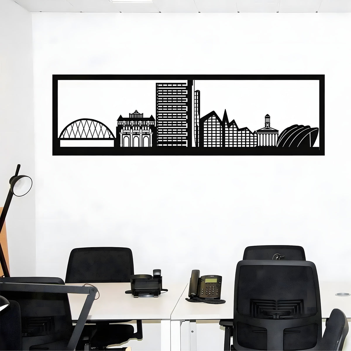 Framed Glasgow skyline metal wall art in black office above dual desks showing Armadillo arena and crane arch