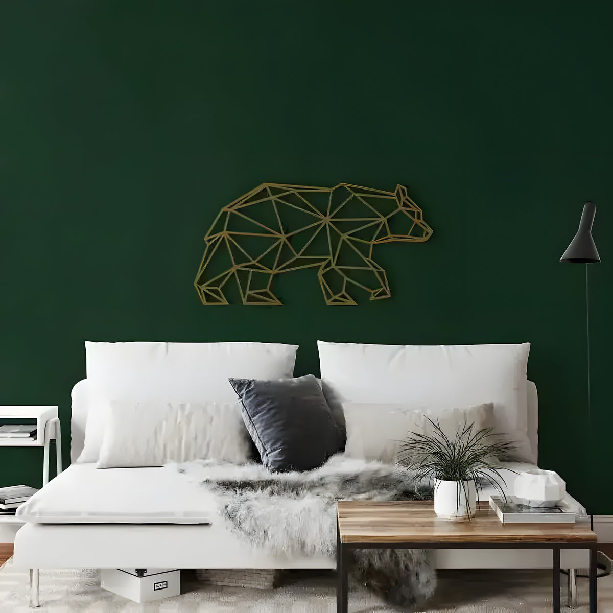 Gold Geometric Bear Metal Wall Decor on dark green wall above white bed with dark pillow and wood nightstand