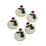 Set of 6 snowman beaded coasters with white bead base, red hat, green scarf and gold border, flat lay view