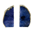 Pair of indigo plated agate bookends, two deep blue natural stone slices with gold-plated irregular edges, white background