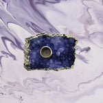 Top-down view of Purple Agate Gemstone taper candle holder, deep indigo druzy agate slab with silver rim and candle socket