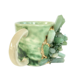 Green quartz marbled ceramic mug side view, sage-green marbled body, white handle, green crystal cluster gold accent
