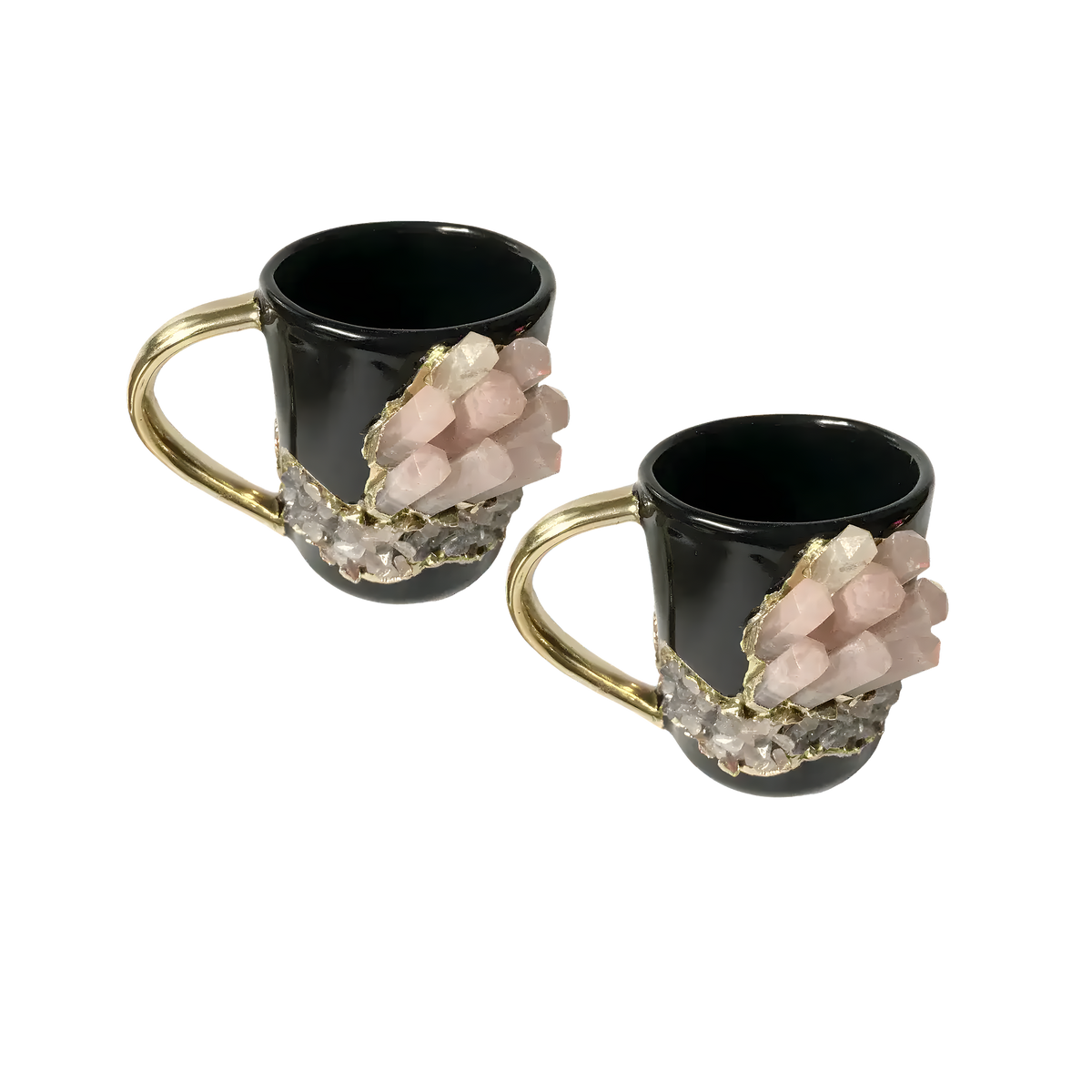 Set of 2 rose quartz crystal black ceramic mugs with gold handles and pink crystal point clusters, overhead view