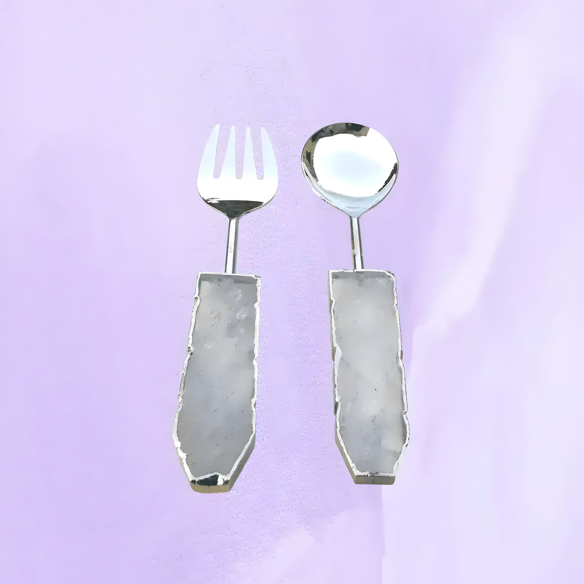 Clear quartz agate salad server set of 2 on lavender background, silver slotted fork and round spoon with pale quartz handles