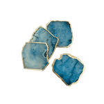 Four blue agate coasters fanned in loose cluster, irregular polished freeform slices in pale to medium blue with gold edge