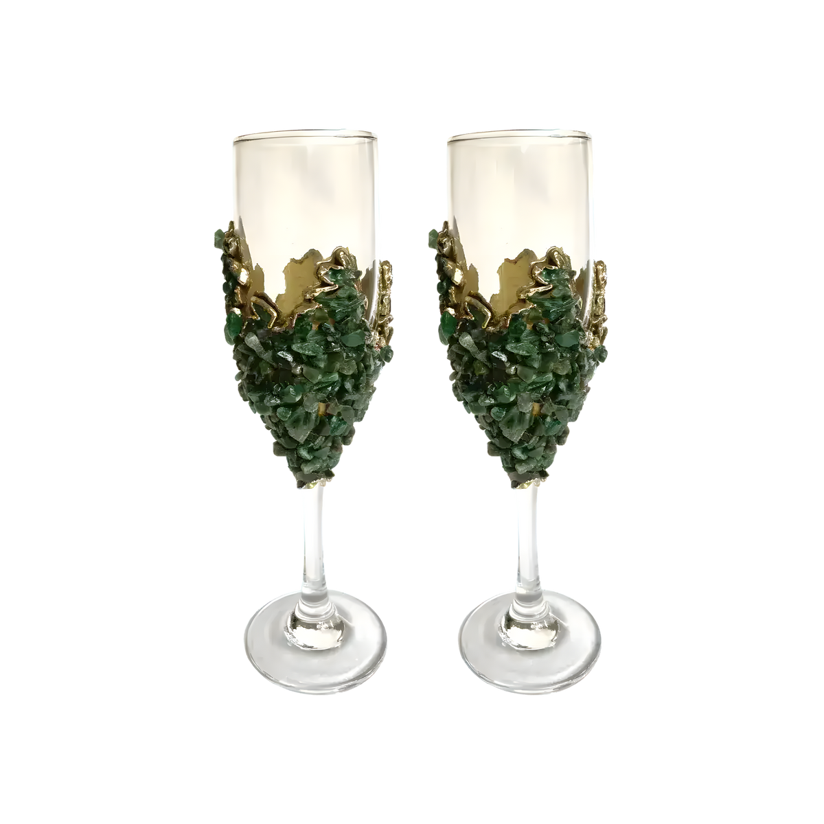 Two dark green quartz champagne flutes with crushed green crystal chip bases and jagged gold crown collar on clear glass flutes