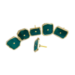 Six emerald green agate knob handles scattered, one upright showing mounting pin, vivid teal-green stone, natural irregular edges, gold trim