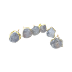 Six raw clear quartz cabinet knobs with gold claw bezels arched in a row on white, two showing screw posts