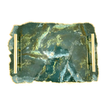 Top-down view of large green agate serving tray with brass handles showing dark green and gold stone surface
