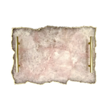 Top-down view of large rose quartz agate serving tray with pink blush stone surface and two parallel brass handles