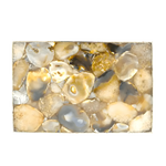 Flat top-down view of large brown agate cheese platter tray with cream and honey rounded stone pieces, gold border