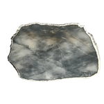 Large grey agate quartz cheese platter tray top-down view, translucent smoky grey surface with silver-plated raw edge