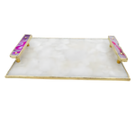 Angled view of white crystal agate serving tray — white hexagonal crystal mosaic surface with gold edge frame and two pink agate onyx handles