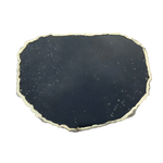 Oval black galaxy granite cheese platter with flat matte dark surface, white mineral speckles and gold serrated organic edge trim
