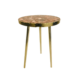Round red agate coffee table with mosaic amber, grey and cream stone top on three slim brass legs