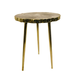 Smoky grey agate organic side table — round grey stone slab with jagged natural edges on three slender brass legs