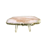 Side view of rose quartz agate cake stand — pale blush pink irregular agate slab with rough gold-leafed edges on brass legs