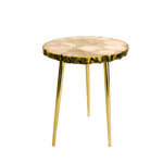 Rose quartz agate accent table with pale pink organic-edge round top, wavy gold rim and three slender gold legs on white background