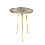 Small round grey agate quartz side table with single-slice stone top, organic gold-rimmed edge and three tall slim gold hairpin legs
