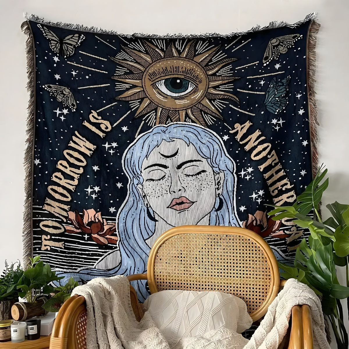 Tomorrow is Another Day woven cotton throw hung as tapestry — dark navy with blue-haired woman, gold eye-sun and star motifs